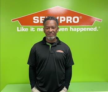 Charles, warehouse manager, pictured in front of SERVPRO background