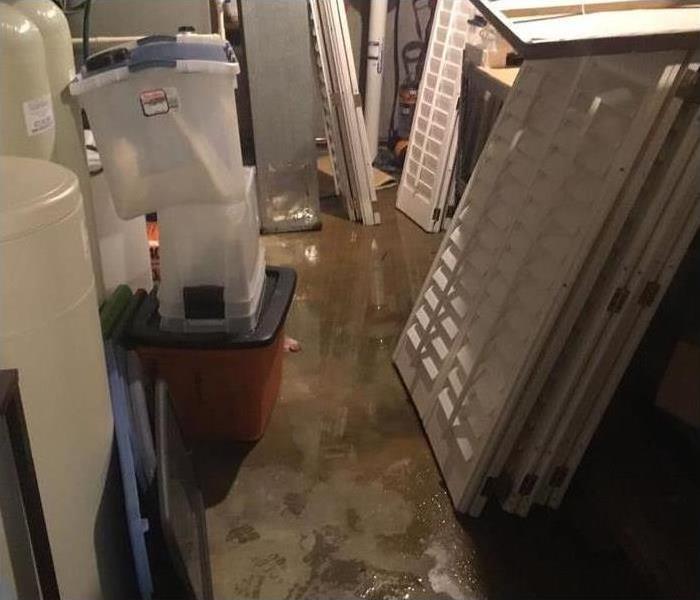 basement with water on the cement floor