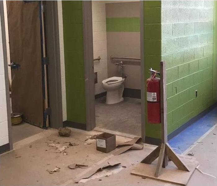 school bathroom with construction debris