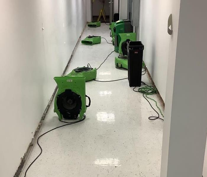Commercial hallway with SERVPRO equipment